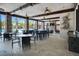 Inviting outdoor lounge with stone columns, ceiling fans, and views of the pool at 1415 Oak Marsh St, Davenport, FL 33837