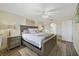 Spacious main bedroom with neutral tones, laminate flooring, ceiling fan, and ample natural light at 14620 Old Forest Ct, Orlando, FL 32826