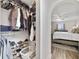 Walk-in closet adjacent to the bedroom, featuring organized shelving for clothes, shoes and accessories at 14620 Old Forest Ct, Orlando, FL 32826