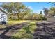 Expansive backyard with lush green grass and additional storage shed at 1475 James St, New Smyrna Beach, FL 32168