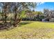 Expansive backyard with lush green grass and additional storage at 1475 James St, New Smyrna Beach, FL 32168