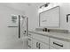 This bathroom offers granite countertops, black fixtures and hardware, and a tub with shower at 1475 James St, New Smyrna Beach, FL 32168