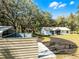 Charming home and additional outbuilding with long driveway and mature shade trees at 1475 James St, New Smyrna Beach, FL 32168