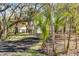 Beautifully landscaped front yard featuring mature trees and well-maintained grounds at 1475 James St, New Smyrna Beach, FL 32168