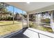 Enclosed lanai providing an outside space for relaxation with a view of the backyard at 1475 James St, New Smyrna Beach, FL 32168
