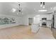 Open floor plan with an eat-in kitchen featuring modern appliances and sleek countertops at 1475 James St, New Smyrna Beach, FL 32168