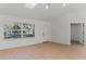 Bright living space with wood floors, large windows, and a view of the front yard at 1475 James St, New Smyrna Beach, FL 32168