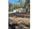 Additional storage building with metal siding and concrete slab at 1475 James St, New Smyrna Beach, FL 32168