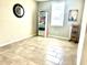 Neutral bedroom with tile floors, a window with blinds, and minimalist decor at 1513 Congaree St # 1513, Davenport, FL 33837