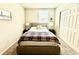 Comfortable bedroom with neutral walls, a queen bed, soft carpeting, and a closet for tidy storage at 1513 Congaree St # 1513, Davenport, FL 33837