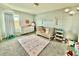 Adorable Bedroom with a crib, changing table, and playful decorations, creating a cozy space for little ones at 1513 Congaree St # 1513, Davenport, FL 33837