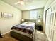Cozy bedroom with neutral walls, comfortable queen bed, and soft carpeting for a relaxing retreat at 1513 Congaree St # 1513, Davenport, FL 33837