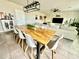 Contemporary dining area with a large wooden table, modern chairs, and an open-concept design at 1513 Congaree St # 1513, Davenport, FL 33837