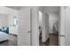 Hallway view to bedroom and bathroom with closet access and furniture at 1529 Redwood Ln, Lake Hamilton, FL 33851