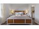 Bright bedroom with white walls, woven headboard, and ensuite bathroom at 2108 Monteverde Ave, Davenport, FL 33837