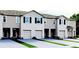 Charming townhome exterior with neutral paint, black shutters, and well-manicured landscaping at 2108 Monteverde Ave, Davenport, FL 33837