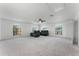 Spacious living area featuring neutral carpeting, abundant natural light, and ample room for entertaining at 219 Strathmore Cir, Kissimmee, FL 34744