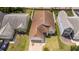 Aerial view of a single Gathering home featuring a driveway and a brown roof at 2218 Newt St, Orlando, FL 32837
