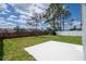 Spacious backyard featuring a brick retaining wall and a new white patio area at 2218 Newt St, Orlando, FL 32837