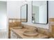 Bathroom featuring a double sink vanity with stone countertop and tiled wall accents at 2218 Newt St, Orlando, FL 32837