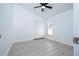Bedroom features a window, ceiling fan, and closet with white bi-fold doors at 2218 Newt St, Orlando, FL 32837