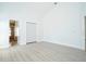 Bright, spacious bedroom featuring light wood floors and a closet with bi-fold doors at 2218 Newt St, Orlando, FL 32837