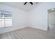 Bedroom with a window and light hardwood flooring at 2218 Newt St, Orlando, FL 32837