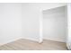Bedroom closet has white bi-fold doors and a wire storage shelf at 2218 Newt St, Orlando, FL 32837