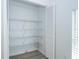 Bright closet featuring ample storage space with multiple wire rack shelves and white bi-fold doors at 2218 Newt St, Orlando, FL 32837
