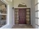 Inviting entryway showcasing a front door with sidelights, transom window, and modern lighting fixtures at 2218 Newt St, Orlando, FL 32837