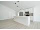 Modern kitchen featuring stainless steel appliances, a breakfast bar, and stylish pendant lights at 2218 Newt St, Orlando, FL 32837