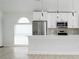 Modern kitchen featuring stainless steel appliances, a breakfast bar, and sleek pendant lighting at 2218 Newt St, Orlando, FL 32837