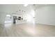 Spacious open floor plan featuring modern kitchen with stainless steel appliances and bright living area at 2218 Newt St, Orlando, FL 32837