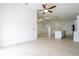 Expansive living area featuring lots of light, ceiling fan, open floor plan, and modern finishes at 2218 Newt St, Orlando, FL 32837