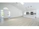 Bright and airy living space featuring vaulted ceilings, skylights, and an open concept kitchen at 2218 Newt St, Orlando, FL 32837