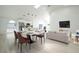 Open-concept living room featuring modern furnishings, a dining area, and bright natural light at 2218 Newt St, Orlando, FL 32837