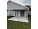 Covered patio with modern black support beams with access to the backyard at 2218 Newt St, Orlando, FL 32837