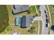 Aerial view of a home with a covered pool enclosure and serene water view at 2315 Anhinga Dr, Kissimmee, FL 34743
