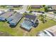 Aerial view of a home highlighting a screened-in pool and well-maintained landscaping at 2315 Anhinga Dr, Kissimmee, FL 34743