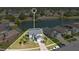 Aerial image showcasing a well-kept home with landscaping, a driveway, and surrounding neighborhood amenities at 2315 Anhinga Dr, Kissimmee, FL 34743