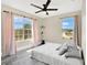 Bedroom offers two large windows with neighborhood views and a ceiling fan at 2315 Anhinga Dr, Kissimmee, FL 34743