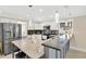 Modern kitchen with stainless steel appliances, breakfast bar, and pendant lighting at 2315 Anhinga Dr, Kissimmee, FL 34743