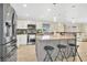Modern kitchen with stainless steel appliances, breakfast bar, and pendant lighting at 2315 Anhinga Dr, Kissimmee, FL 34743