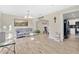Bright living room features wood-look floors, modern lighting, and neutral paint at 2315 Anhinga Dr, Kissimmee, FL 34743