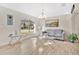Bright living room features wood-look floors, modern lighting, and neutral paint at 2315 Anhinga Dr, Kissimmee, FL 34743
