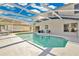 Enclosed pool area with inviting pool, a covered patio, and a water view at 2315 Anhinga Dr, Kissimmee, FL 34743