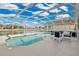 The pool has a covered enclosure and a scenic water view at 2315 Anhinga Dr, Kissimmee, FL 34743
