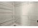 Empty walk-in closet with built in shelves and rods at 2315 Anhinga Dr, Kissimmee, FL 34743