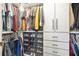 Walk-in closet features custom shelves, drawers, and hanging storage space at 2315 Anhinga Dr, Kissimmee, FL 34743