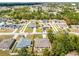 An aerial view of the home and surrounding neighborhood showing the fence line at 236 Elm Ct, Kissimmee, FL 34759